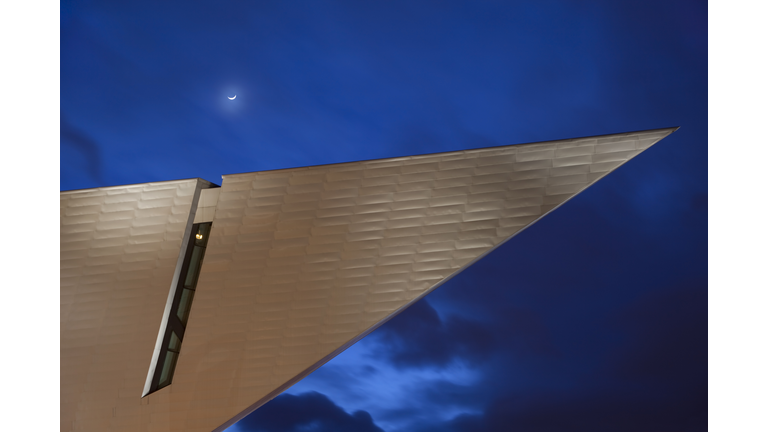 Downtown Denver Art Museum with moon at Night Colorado