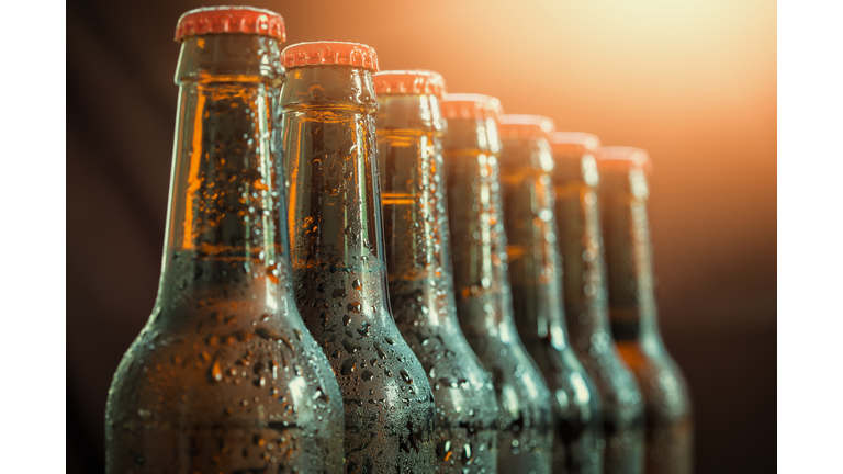 Glass bottles of beer on the dark background