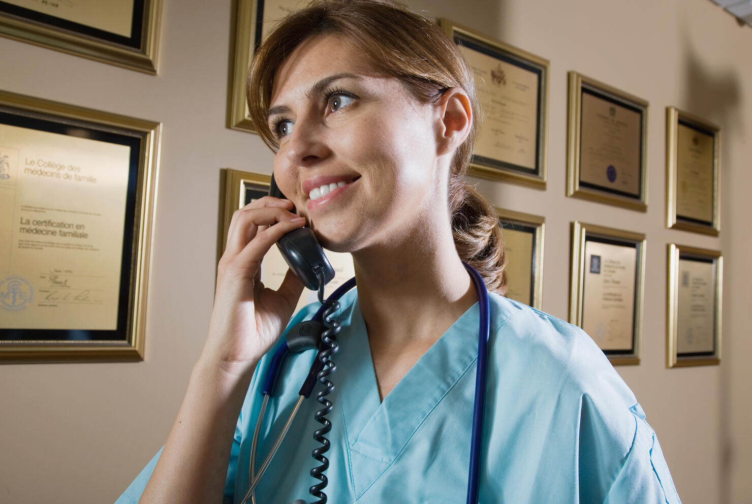 Nurse answering the phone at reception