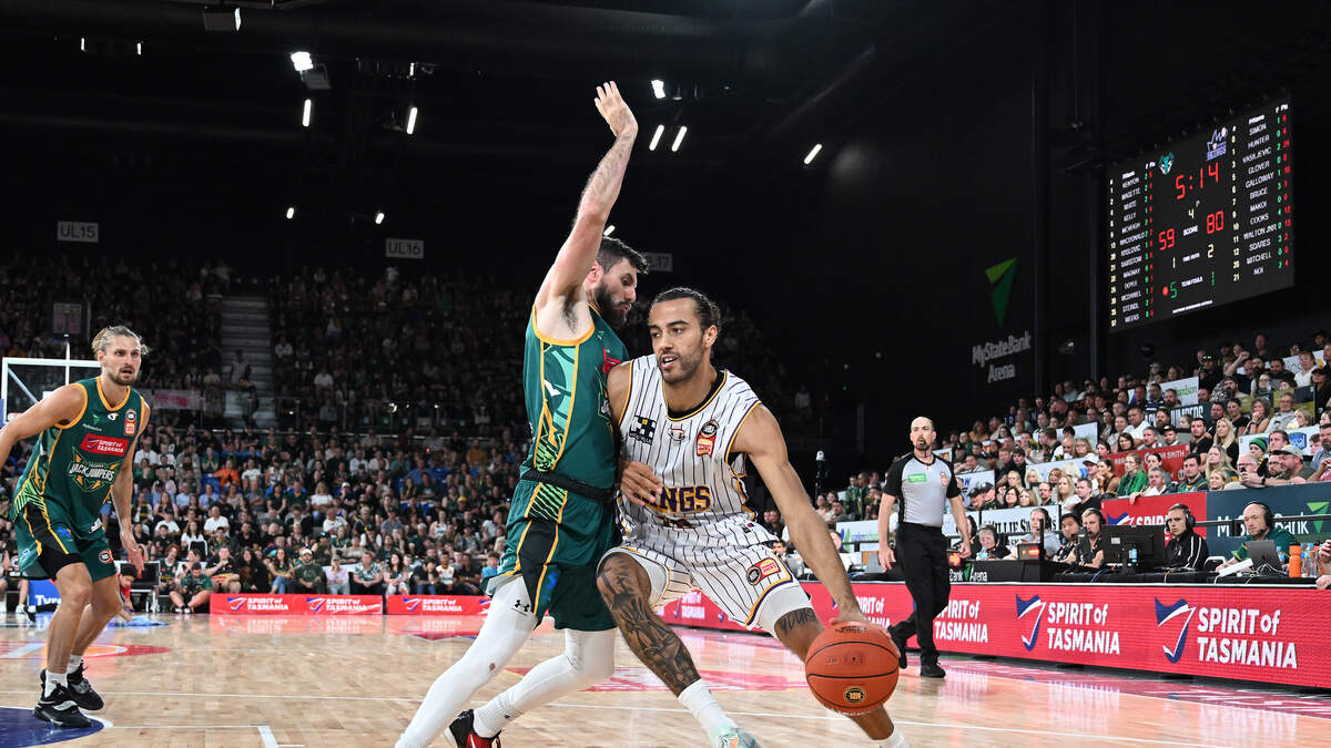 Uber Eats delivery man walks on court during a live basketball