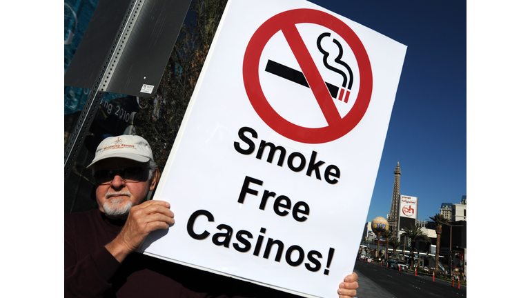 A man protests for smoke free casinos in