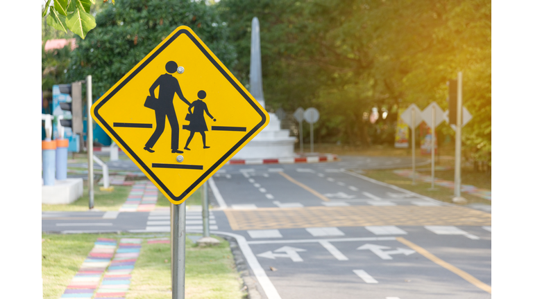 Students crossing ahead sign