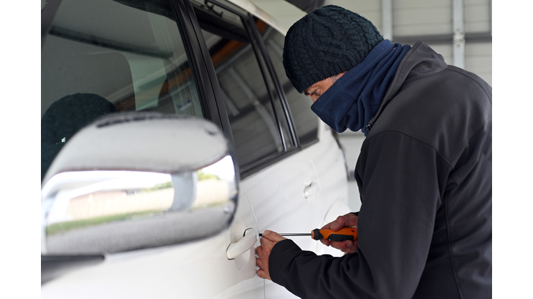 Car theft breaking into a car