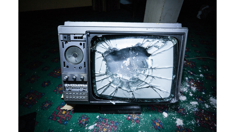 A smashed television on the ground
