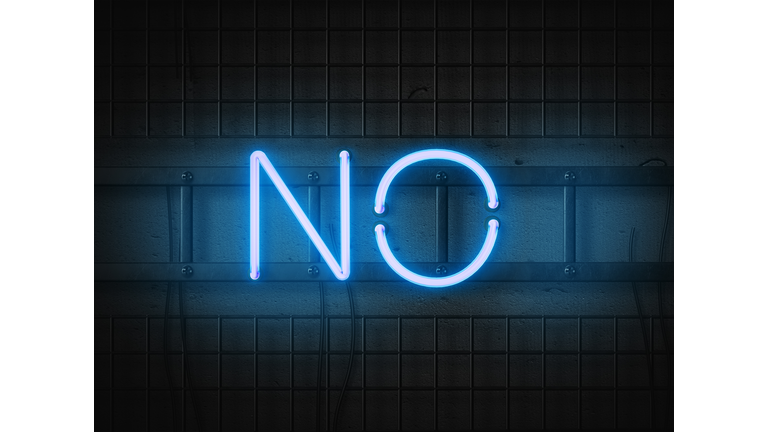 No message in neon style against black brick wall