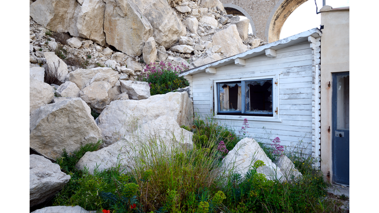 Damaged House After Landslide or Rock Fall