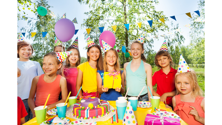 Big happy kid's company celebrating Birthday