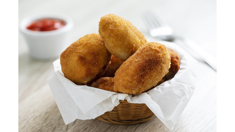 Homemade croquetas with tomato sauce