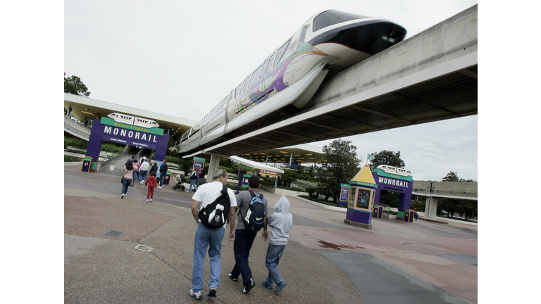 Visitors to Walt Disney World walk towar