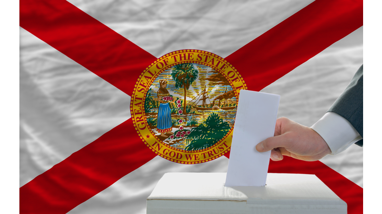 elections voting in front of flag of florida