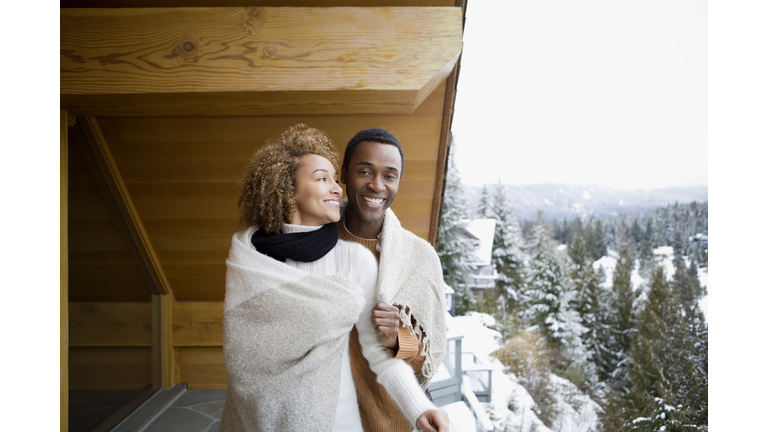 Couple wearing a blanket