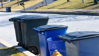 Woman Pretends to Pick Up Trash on Beach