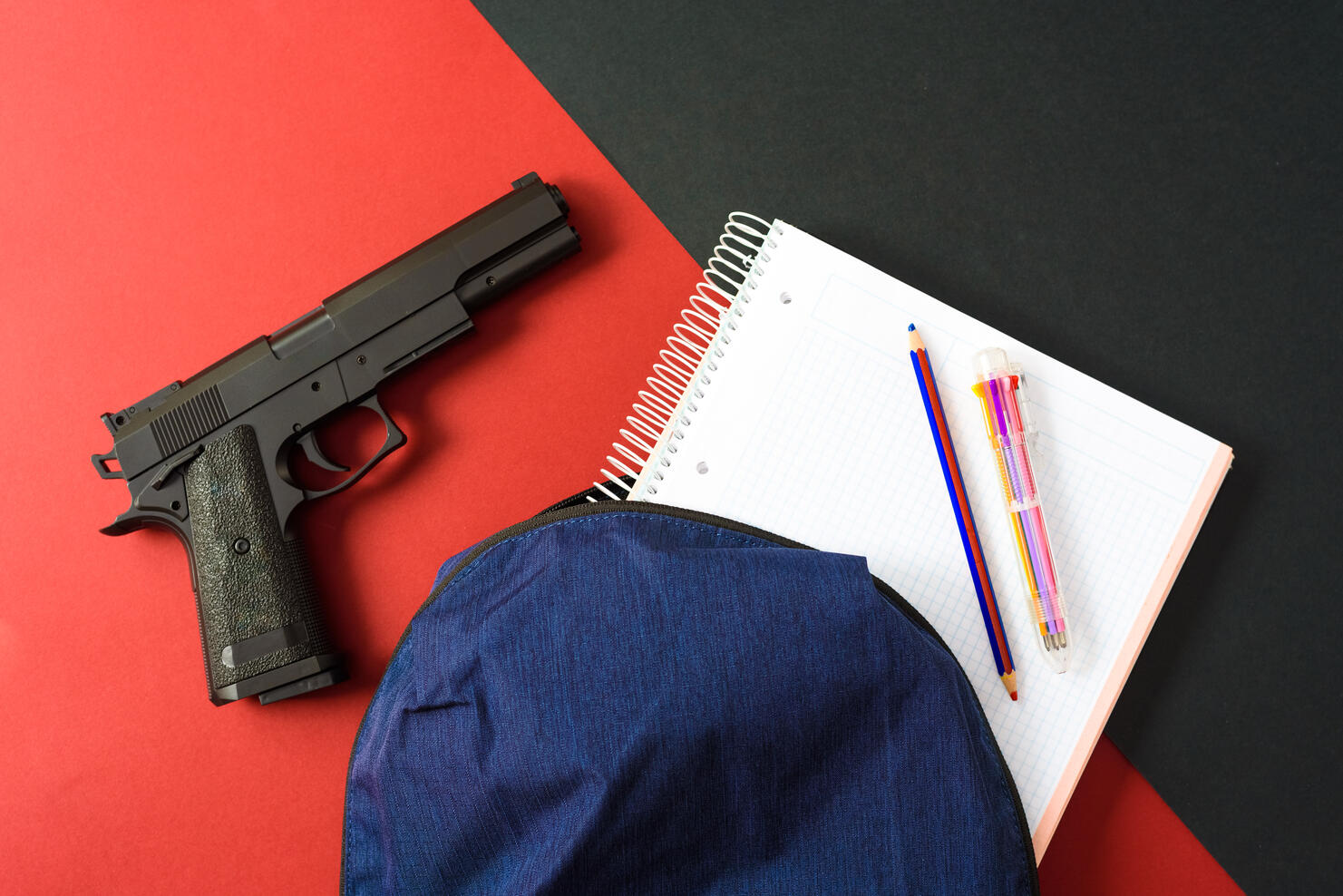 A firearm on the backpack of a young man at school, a loaded gun in a school.