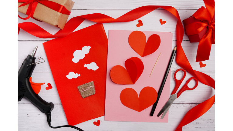 Valentines diy. Step by step instruction for handmade valentine greeting card with parachute from hearts. Craft gift, flat lay. step 2