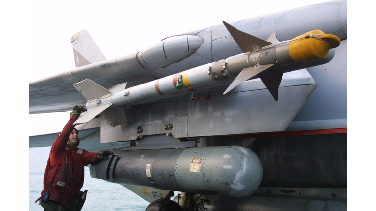 A US sailor checks the AIM-9 sidewinder of a F-14