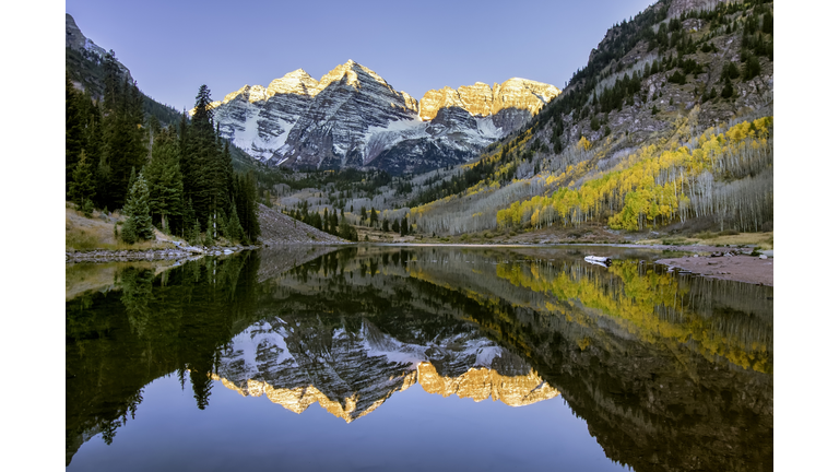 Snowcapped Maroon Bells Mountains With Reflection and Fall Foliage Aspen Colors at Sunrise