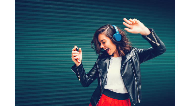 Young girl dancing to the music