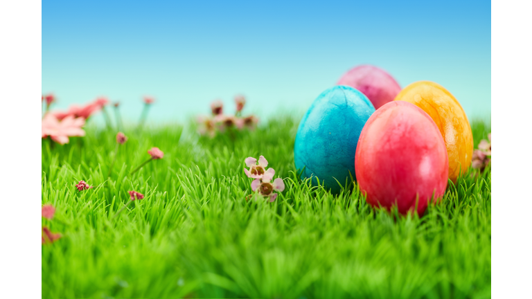 Close-Up Of Colorful Easter Eggs On Grassy Field