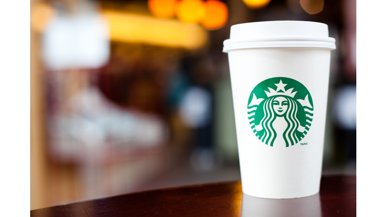 Grande Starbucks to go cup on table