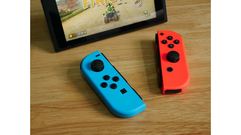 Bangkok, Thailand - June 25, 2017 : Nintendo Switch, the video game console on wooden table.