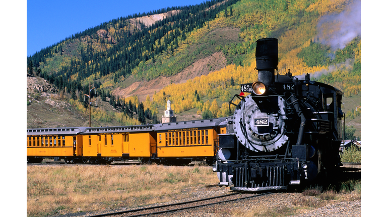 Steam train leaving town on Durango and Silverton Narrow Gauge Railroad.