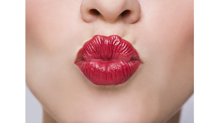 Close up a woman's lips Kissing or puckering