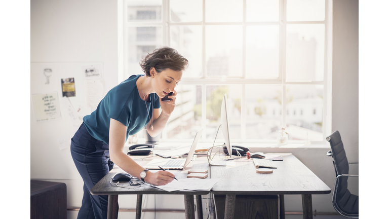 Businesswoman on phone talking to client