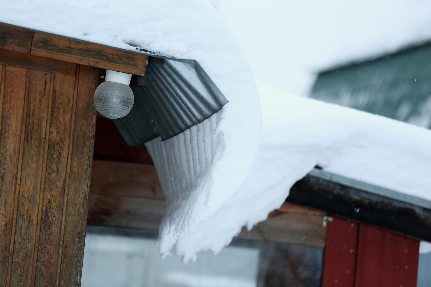 Huge Snowdrift On The Roof Of The House