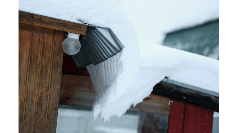 Huge Snowdrift On The Roof Of The House