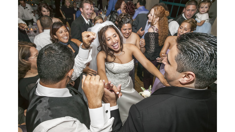 High angle view of bride and groom dancing at wedding reception