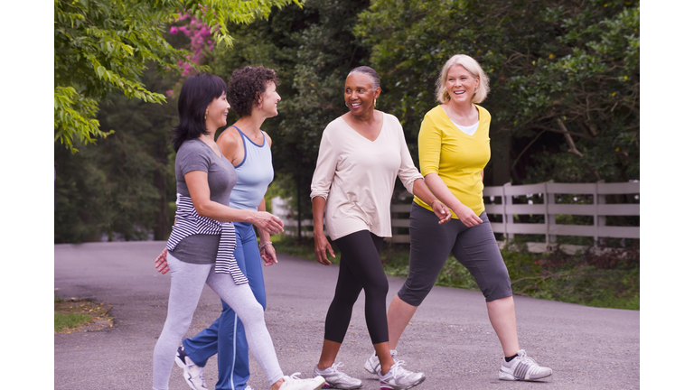 Older women walking together outdoors