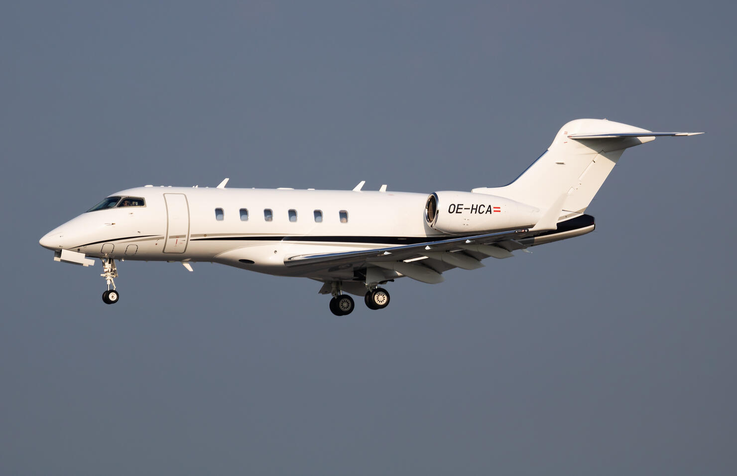 AVAG Air Bombardier BD-100 Challenger 300 OE-HCA passenger plane arrival and landing at Vienna Airport