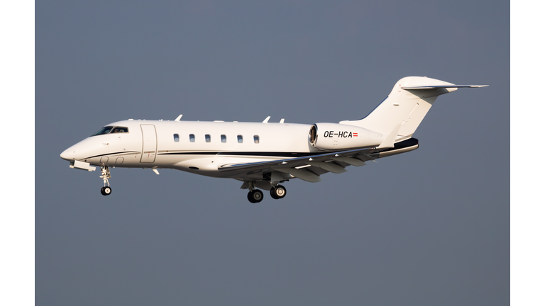 AVAG Air Bombardier BD-100 Challenger 300 OE-HCA passenger plane arrival and landing at Vienna Airport