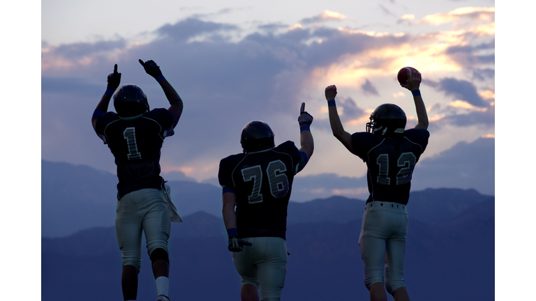 Football players cheering in game