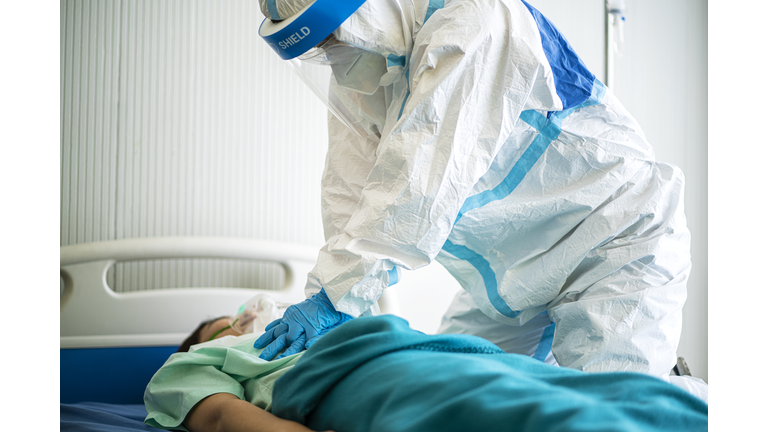 Doctor Performing CPR On Coronavirus or Covid-19 Patient At Hospital
