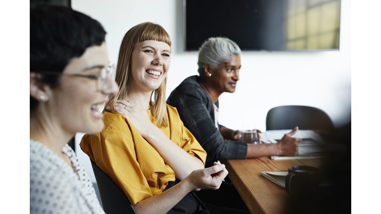 Entrepreneur with coworker in office meeting