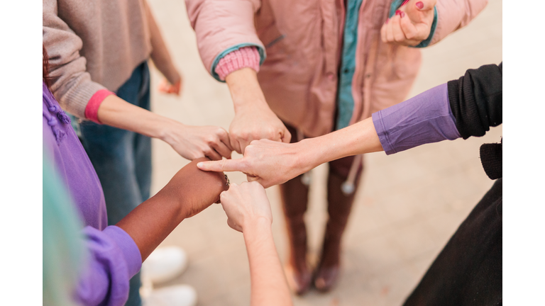 Midsection Of People Stacking Hands