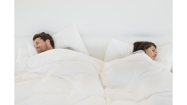 Couple sleeping on the bed