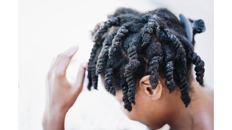 High Angle Close-Up Of Boy Dreadlocks Against White Background
