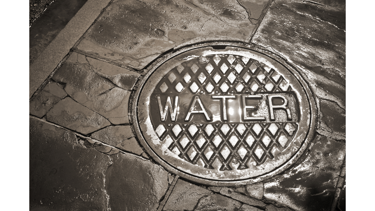 Wet Manhole Cover, Bourbon Street, New Orleans, LA