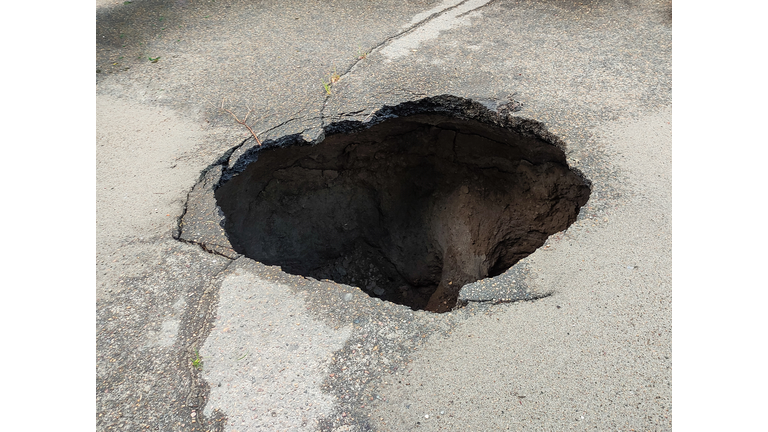 Large hole in the asphalt, sinkhole