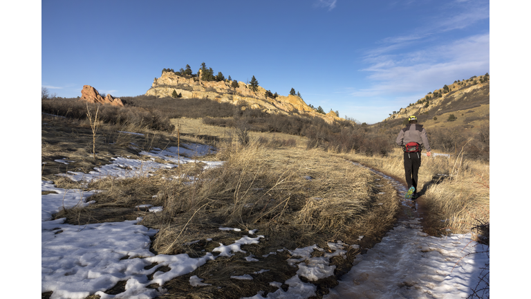 Man trail running Willow Creek Trail Roxborough State Park red rocks Colorado Rocky Mountains