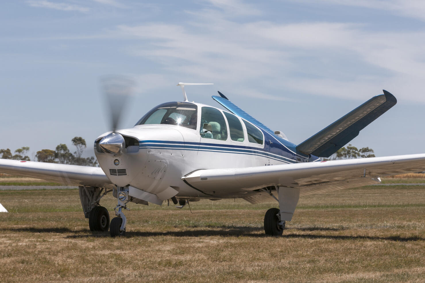 Beech V35 Bonanza single engine light aircraft taxiing at Lethbridge airfield.