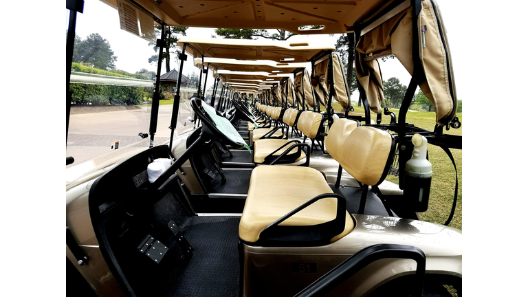 Golf Carts Parked In A Row