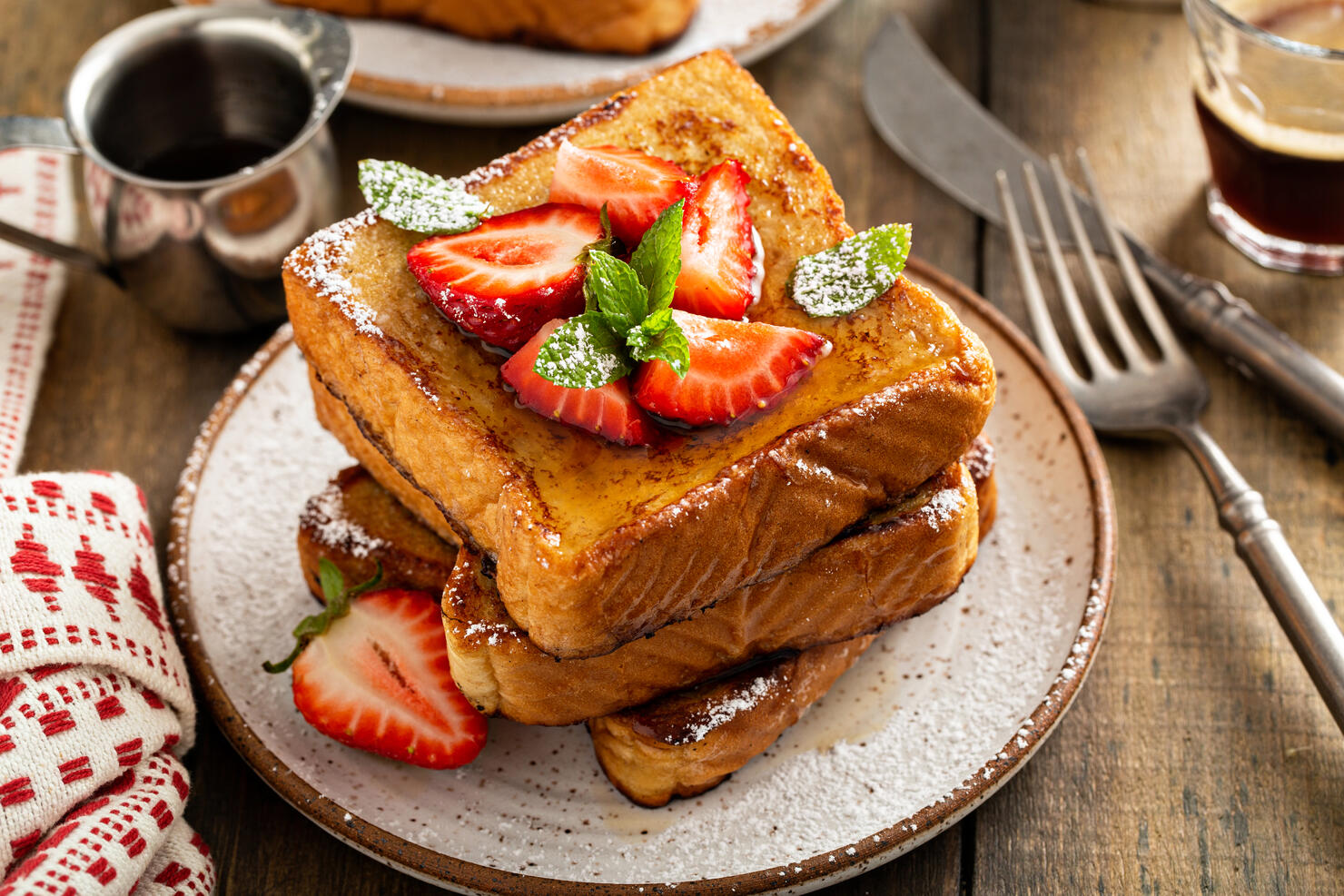 French toasts with strawberry and powdered sugar