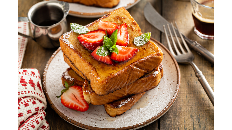 French toasts with strawberry and powdered sugar