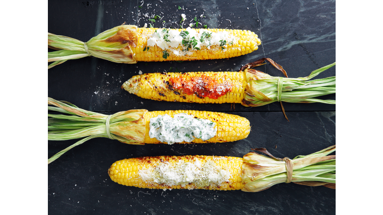 Grilled corn with toppings