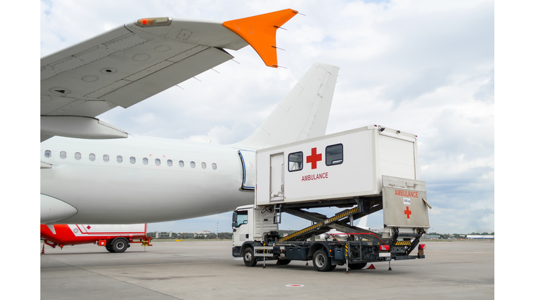Airplane at the airport with loading ladder for disabled people