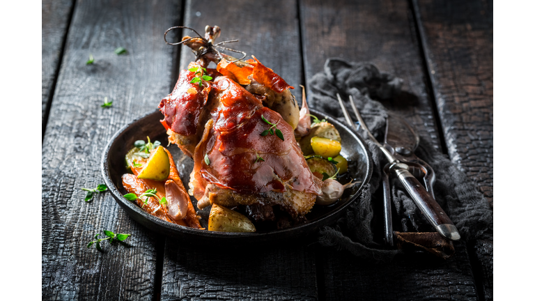 Grilled pheasant with bacon and spices and vegetables