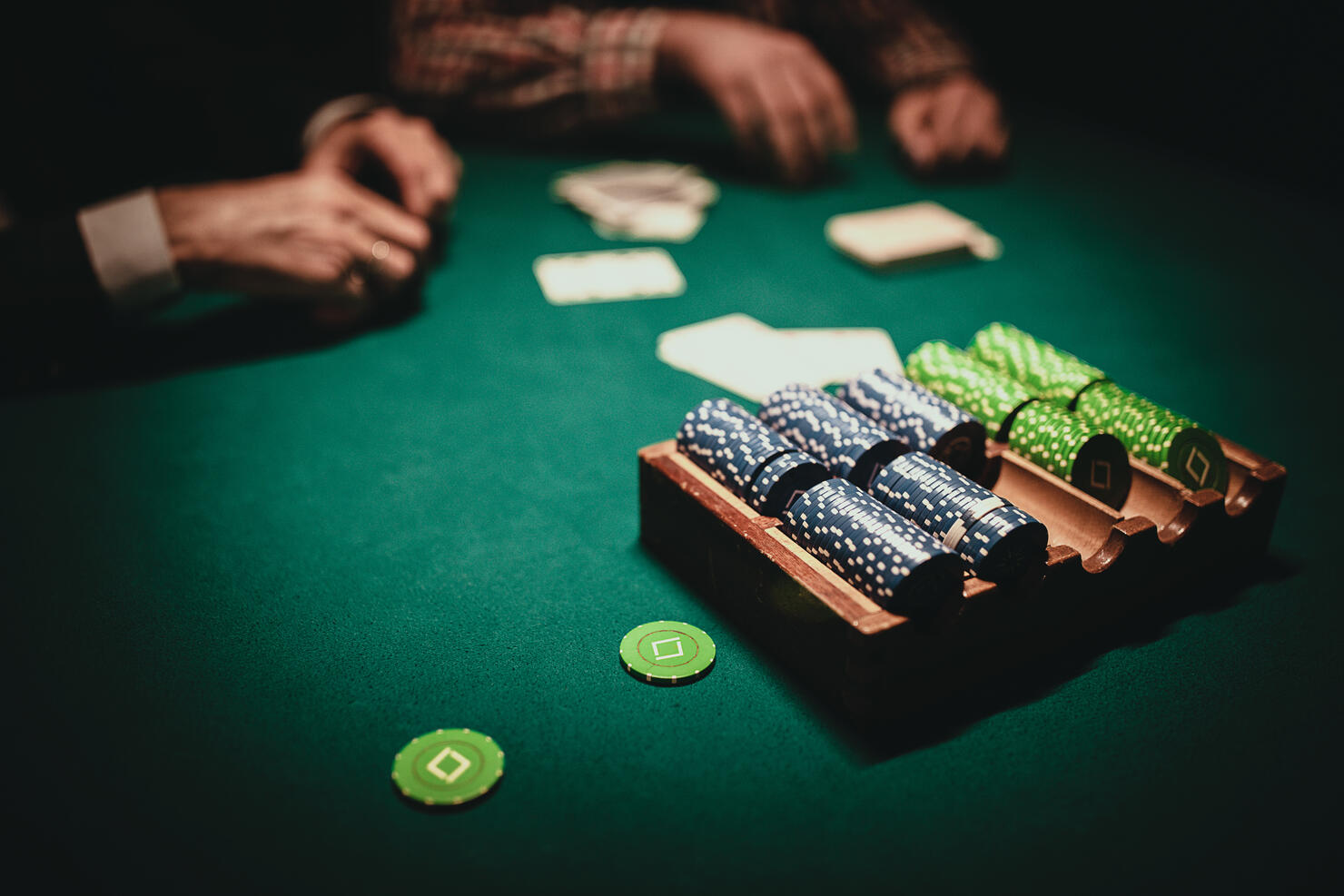 Table with playing cards and chips in casino